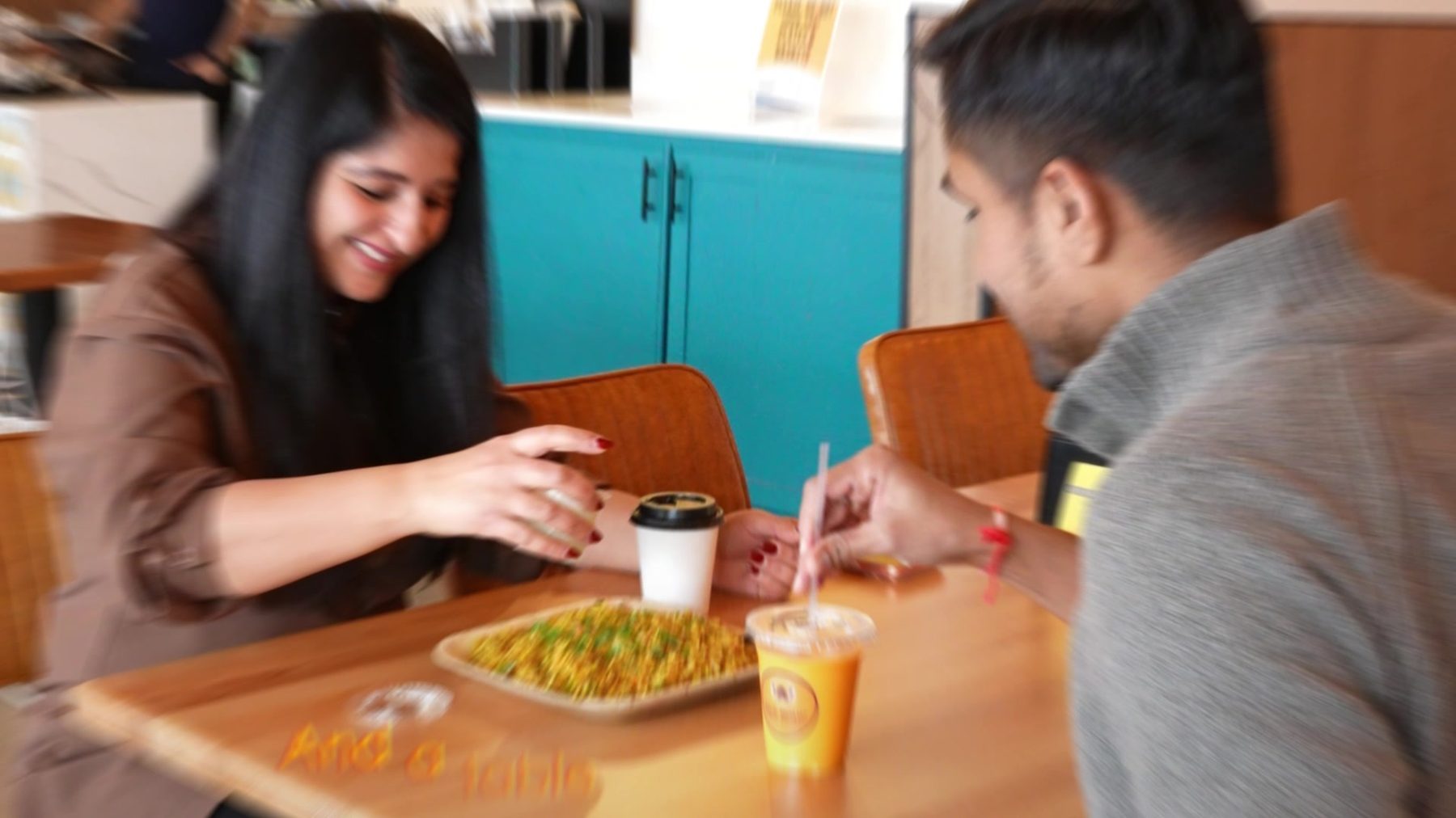 Two people sharing a meal at Eggholic